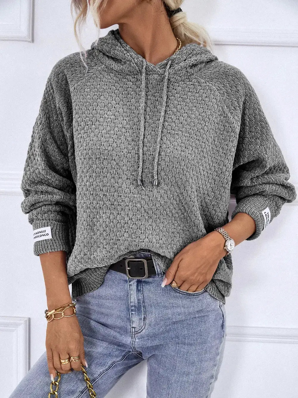 Textured drawstring hoodie sweater in grey; long sleeves, premium polyester.