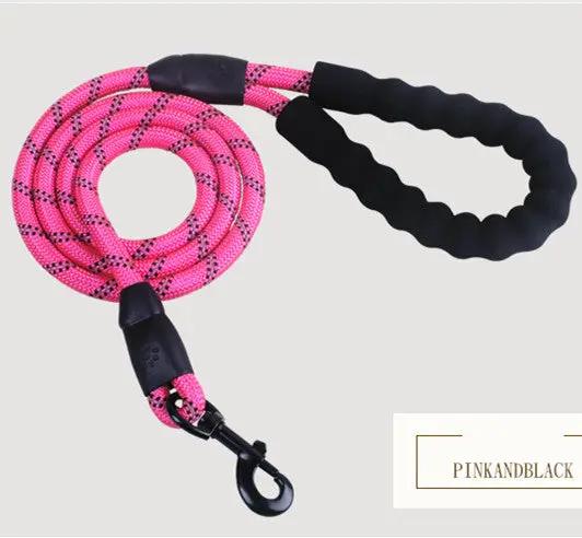 Reflective pink nylon dog leash with black foam handle and metal clip for walking and training.