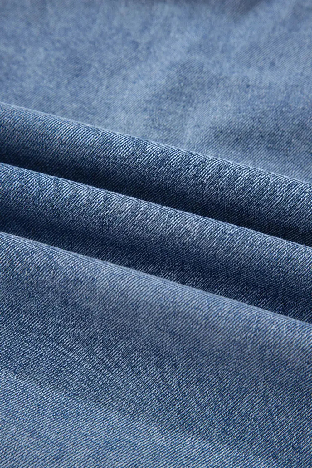 Denim top by Trendsi for women, blue denim fabric close-up