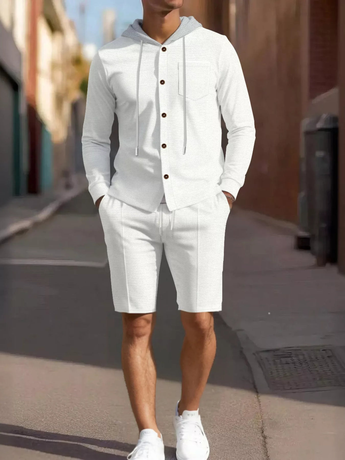 Plus-size men's white hooded button-up top and shorts set; casual loungewear with drawstring hood and pocket.