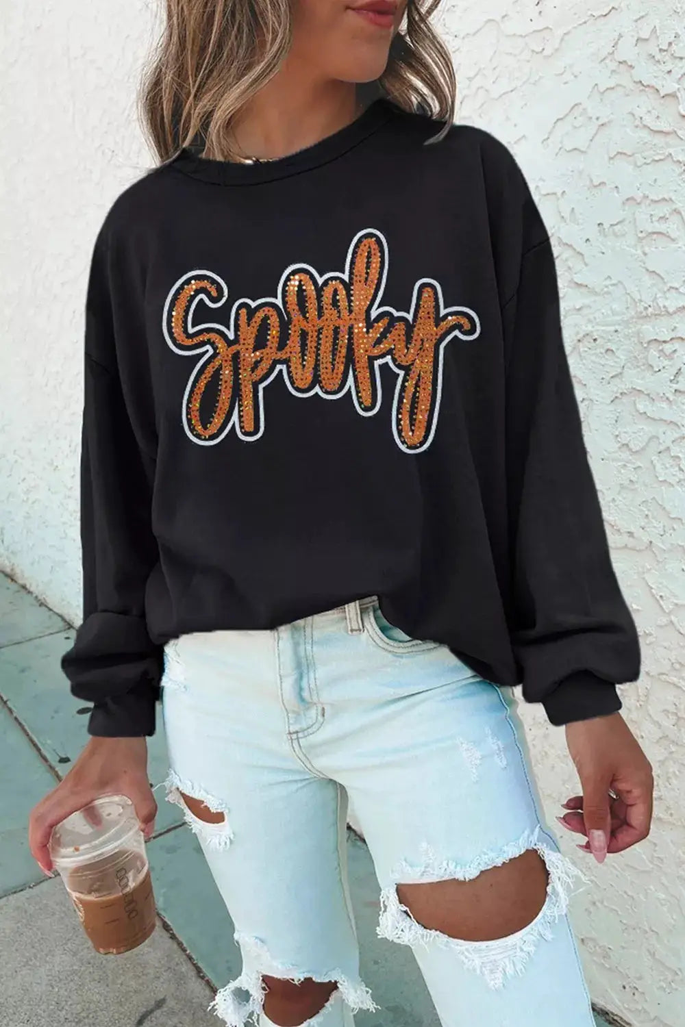 Spooky Rhinestone Drop Shoulder Sweatshirt in black with orange rhinestone lettering