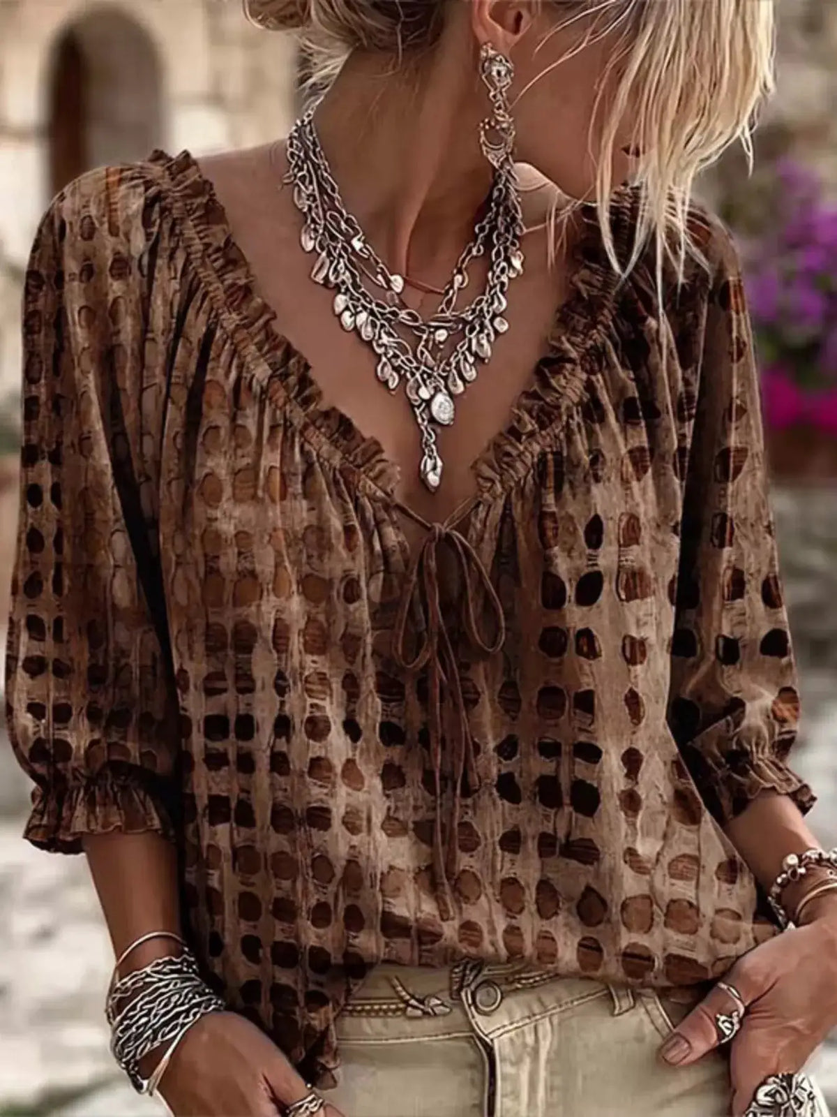 Plus-size tie-neck blouse in brown printed pattern with 3/4 sleeves