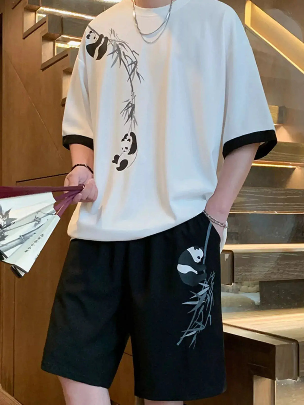 Men's oversized panda bamboo print tee and shorts set, white tee with black panda-bamboo print, black shorts, Trendsi.