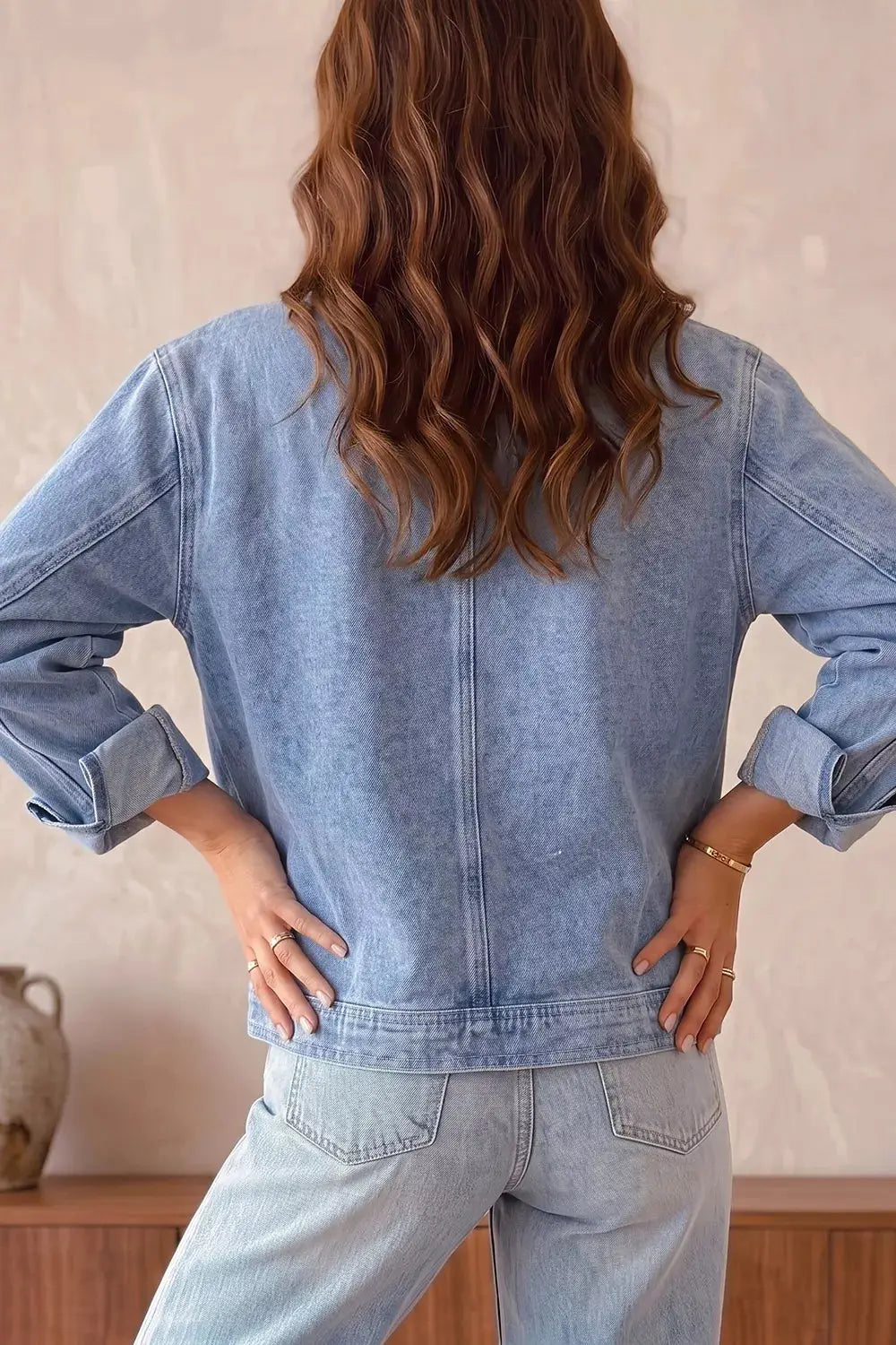 Long Sleeve Studded Metal Zipper Denim Jacket With Rivet Pockets in light-wash denim, back view