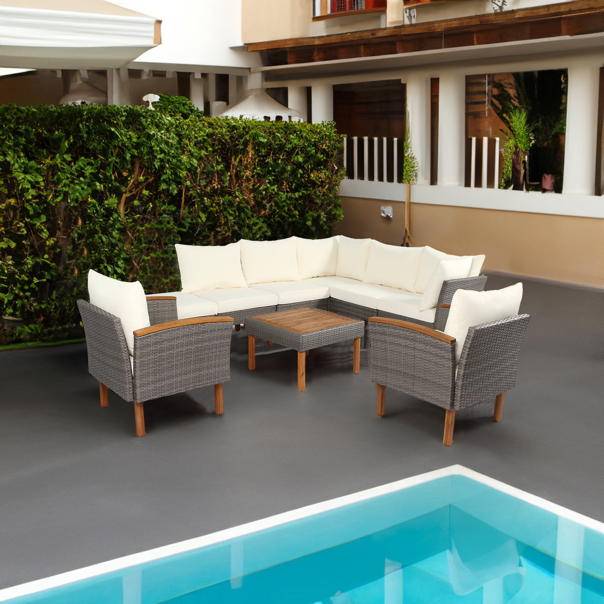 9-piece patio rattan furniture set with beige washable cushions, acacia wood legs and coffee table.