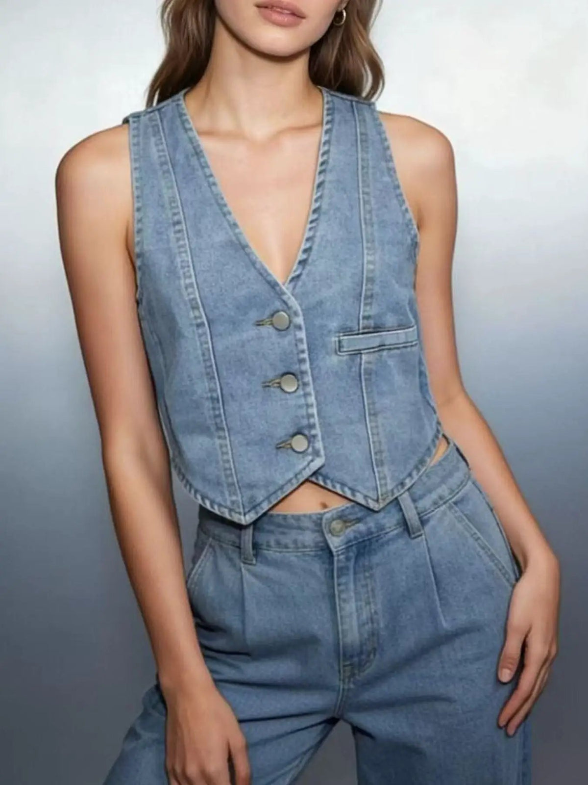 Unlined button-down denim vest in light-wash blue with matching jeans by Trendsi