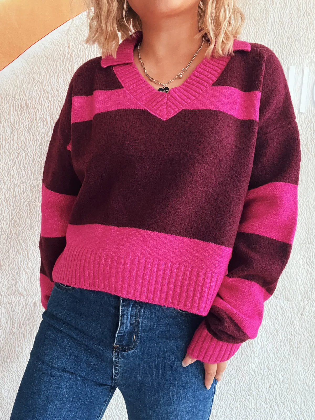 Color-block long sleeve sweater in burgundy and hot pink with a ribbed V-neck and soft stretch polyester blend