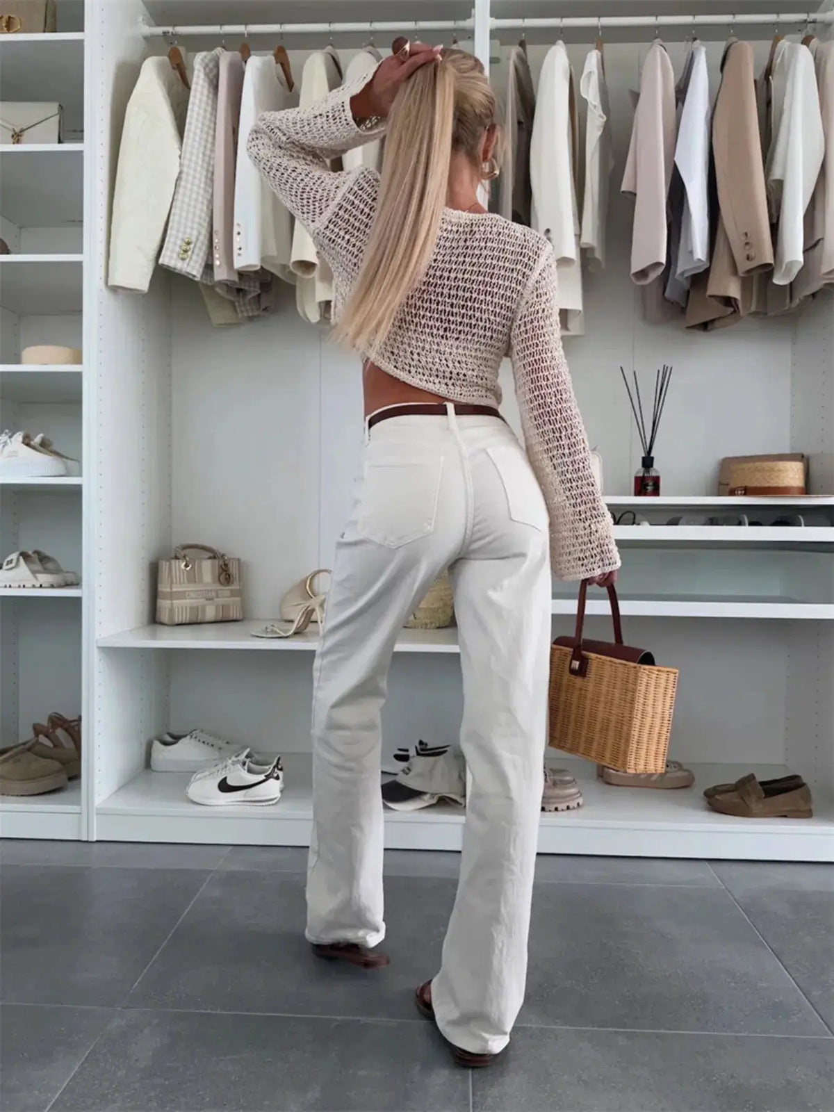 Lightweight breezy openwork knit bikini cover-up top, cream long-sleeve cropped cardigan style.