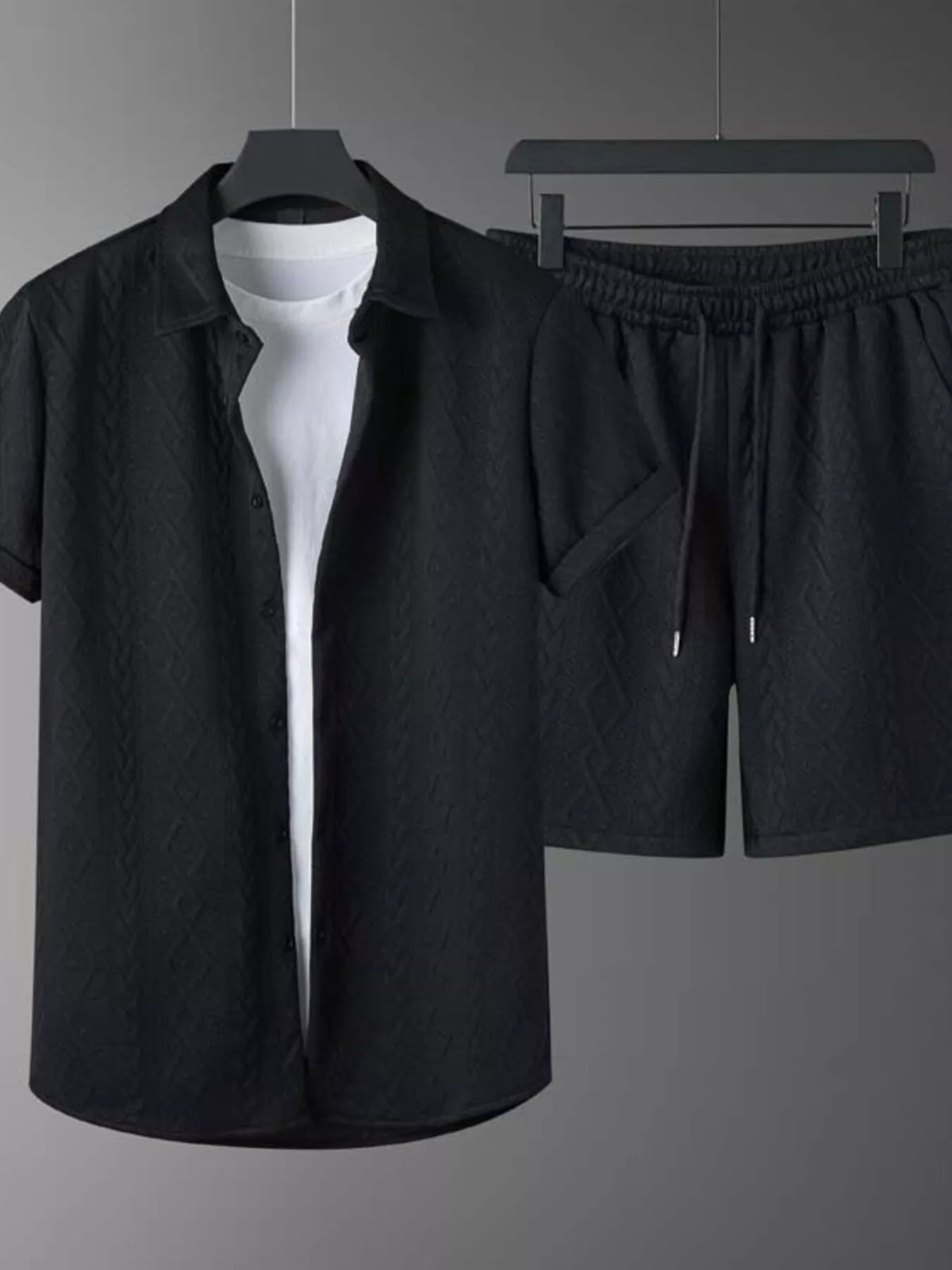 Men's textured knit short-sleeve polo and shorts set in black by Trendsi