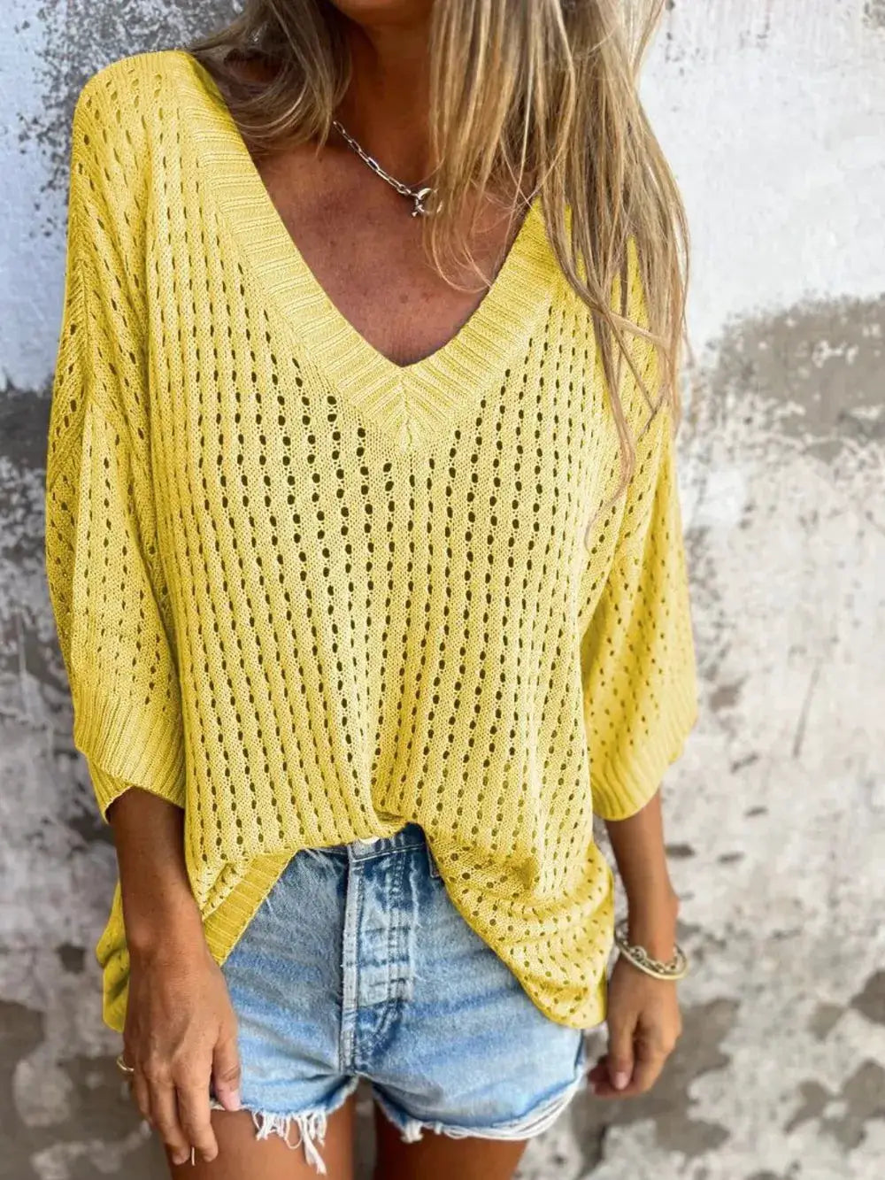 Plus size openwork V-neck knit cover-up, yellow, lightweight stretchy fabric worn over distressed denim shorts
