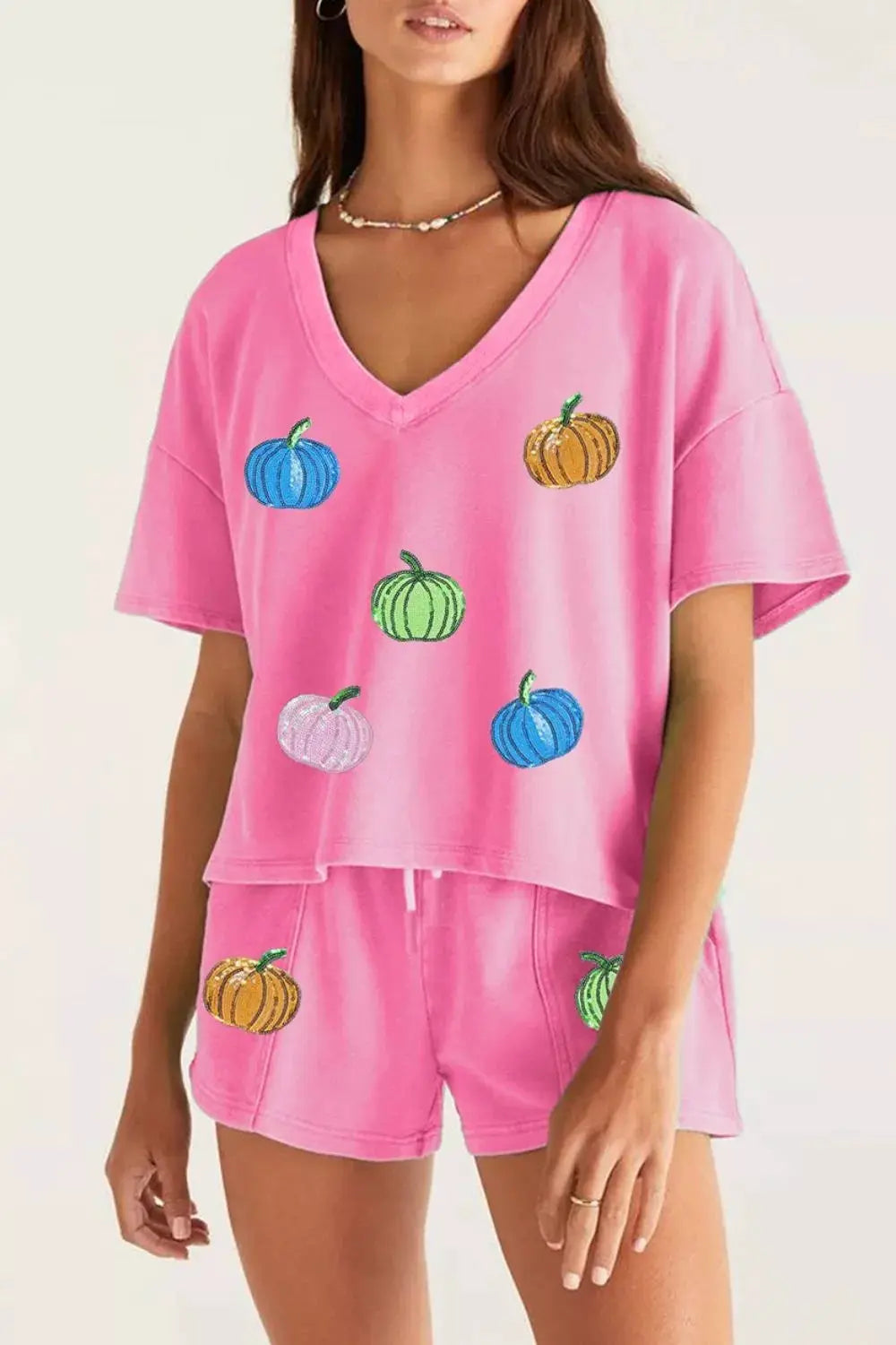 Sequin pumpkin-pattern V-neck tee and matching pink 2-piece drawstring shorts set by Trendsi