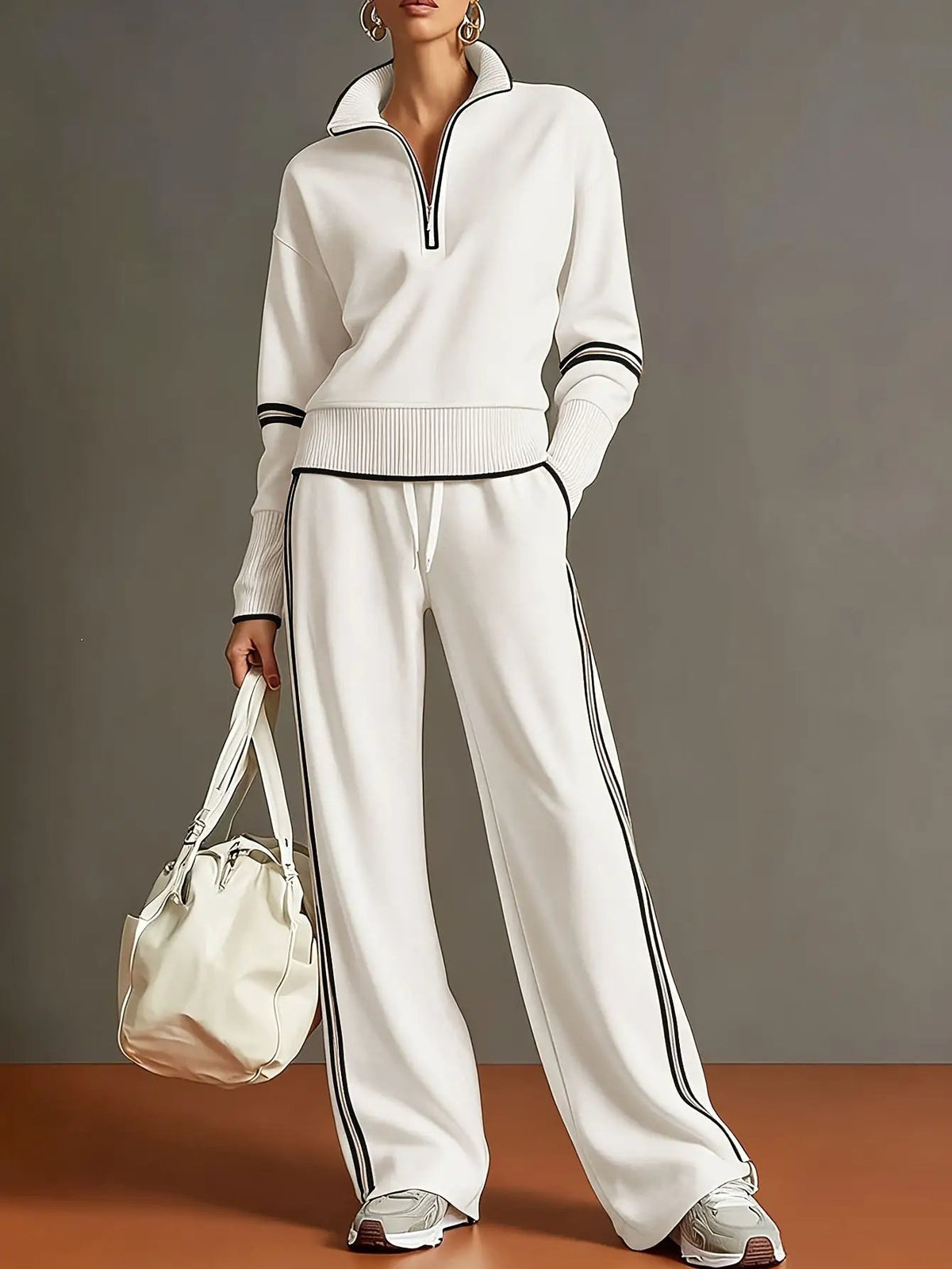 Women active cotton long sleeve two-piece set by AdTec in white with black piping, zip-neck and ribbed cuffs.