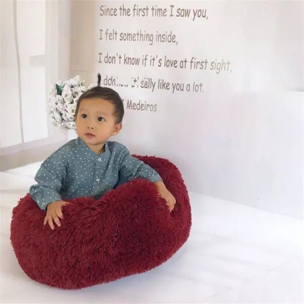Round red plush nest pad cat bed with long-haired texture
