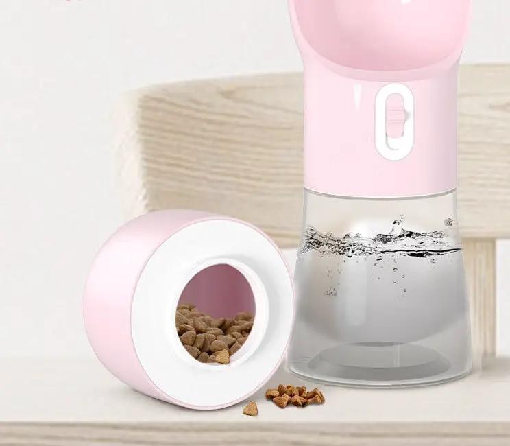 Traveling Out Portable Dog Water Dispenser by AdTec in pink with clear reservoir and kibble dish