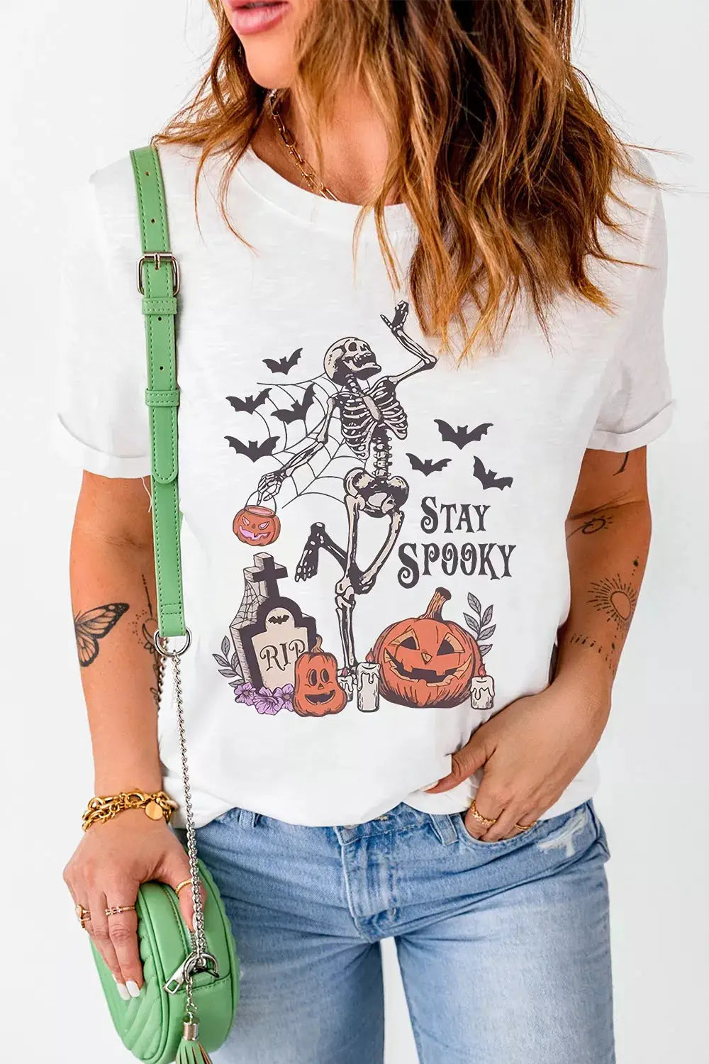 Stay Spooky graphic Halloween T-shirt by Trendsi, plus-size white with skeleton and pumpkins