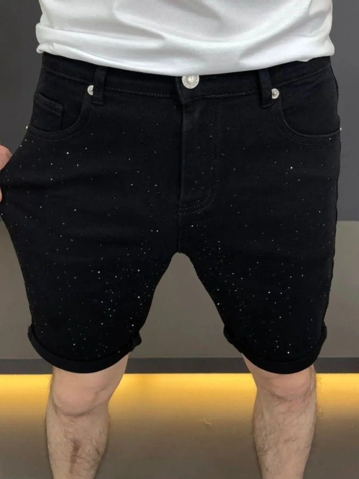 Men's black speckled cotton-stretch denim shorts with pockets and rolled cuffs