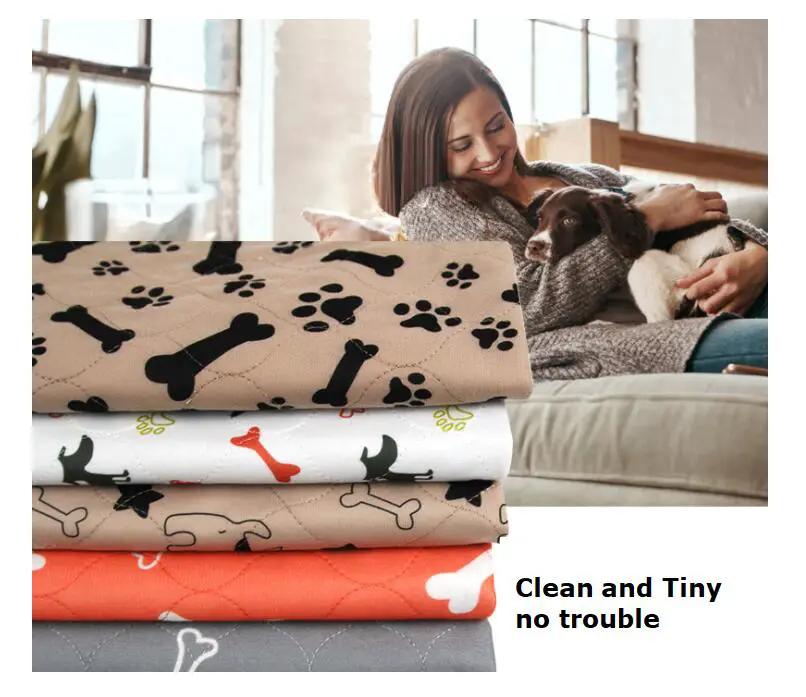 AdTec Three-layer Waterproof Pet Absorbent Pad; stack of five paw and bone print pads in beige, white, red, and gray.