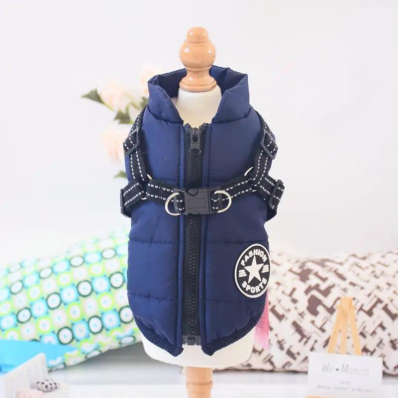 Navy padded waterproof dog coat with built-in harness; adjustable straps and metal D-rings.