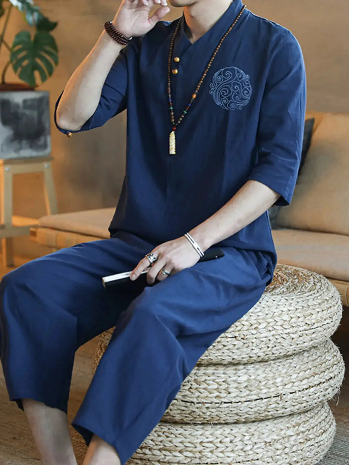 Mens plus-size navy lounge set with three-quarter-sleeve top and embroidered circular motif