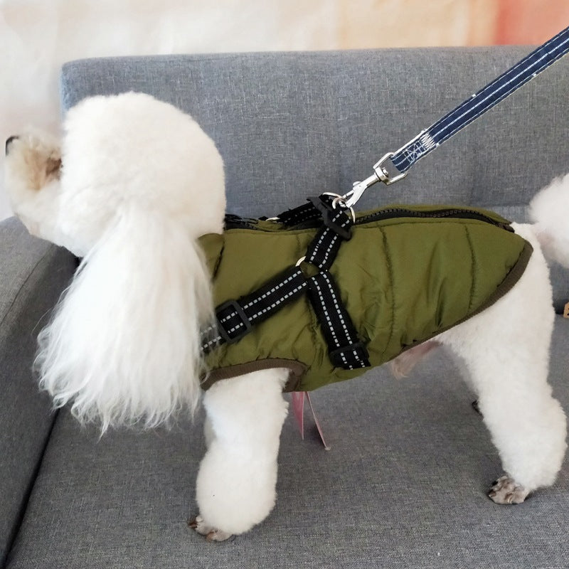 Waterproof dog coat with harness in olive green by AdTec on a fluffy white dog displayed on a gray sofa