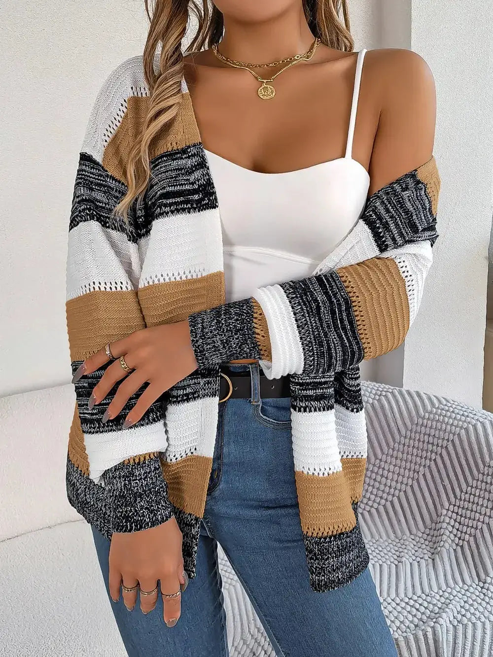 Openwork striped open-front lightweight cardigan in white, camel, black and gray; oversized relaxed fit.