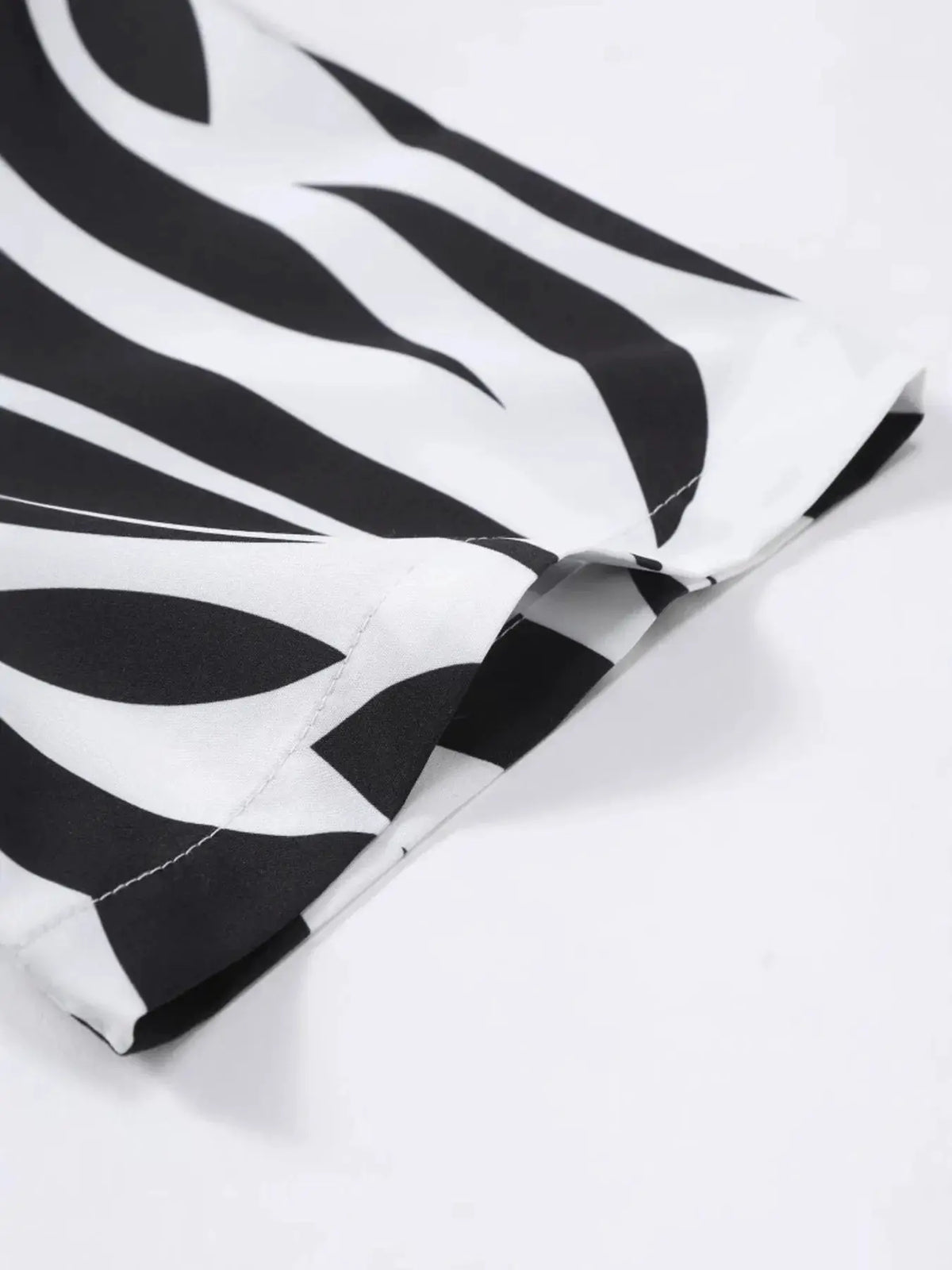 Men's zebra print two-piece short-sleeve shirt and shorts set in black and white.