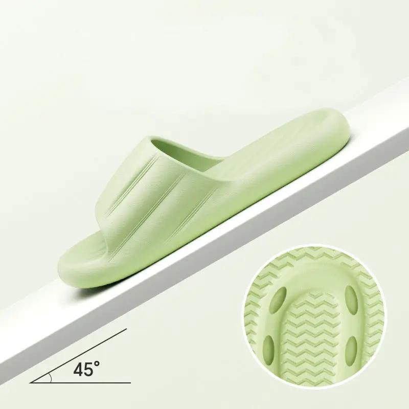 Unisex summer indoor slippers light green slide with ribbed strap and textured sole.