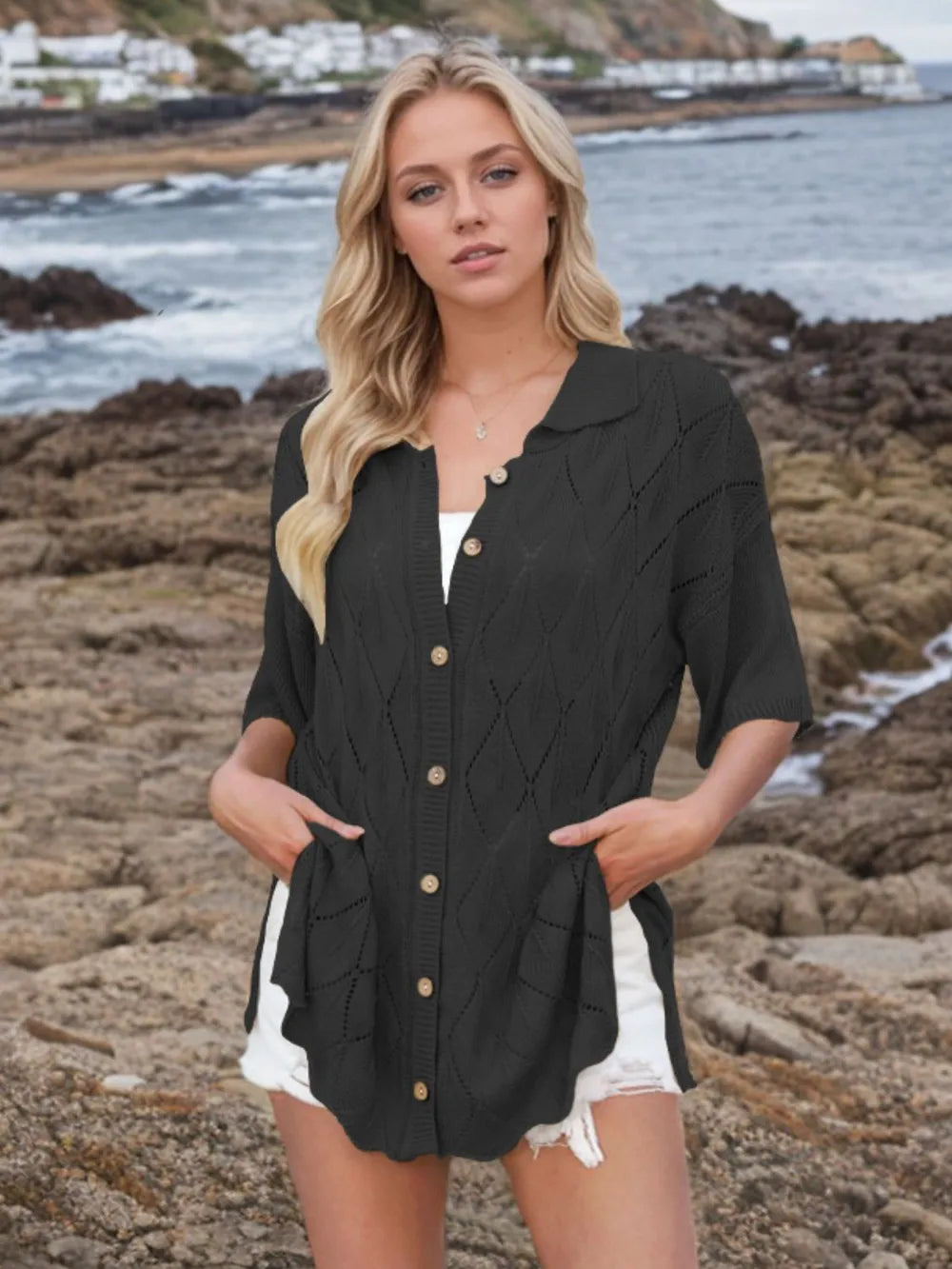 Womens button-down eyelet knit shirt in black with collar, front buttons, and pockets