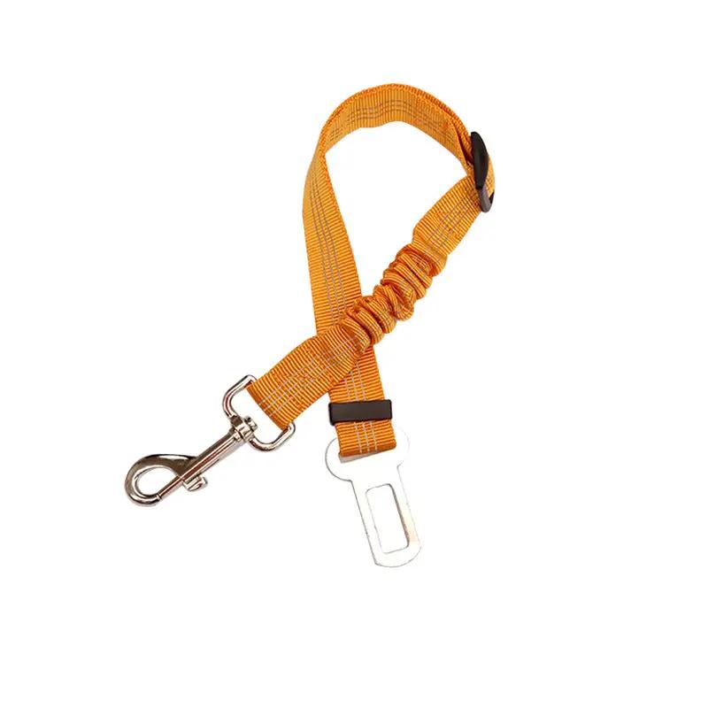 Adjustable orange nylon dog car seat belt with metal clip and white plastic buckle.