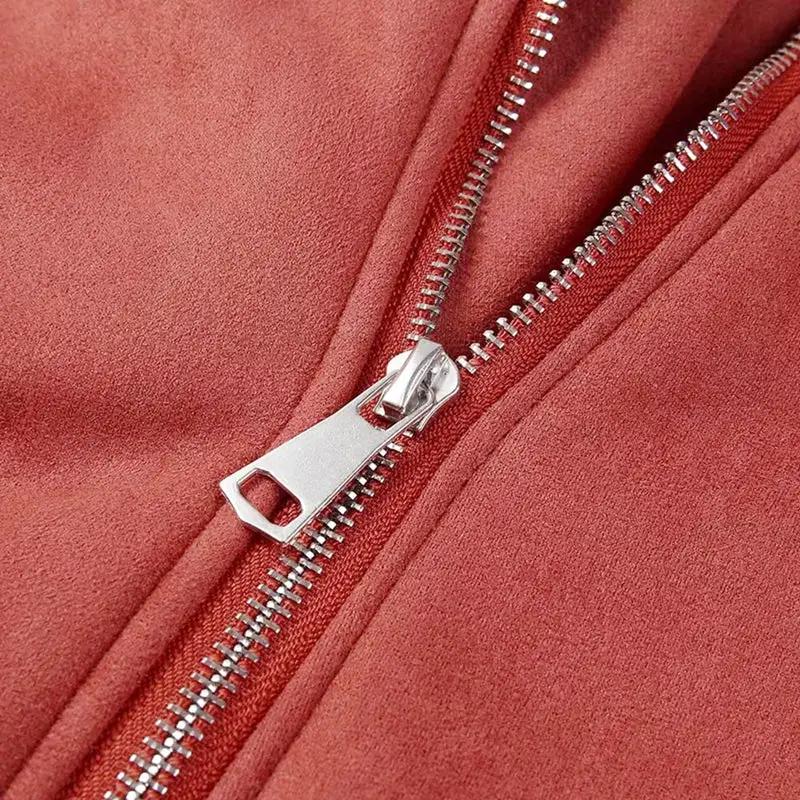 Suede leather jacket and lamb wool warm coat close-up in red with silver zipper