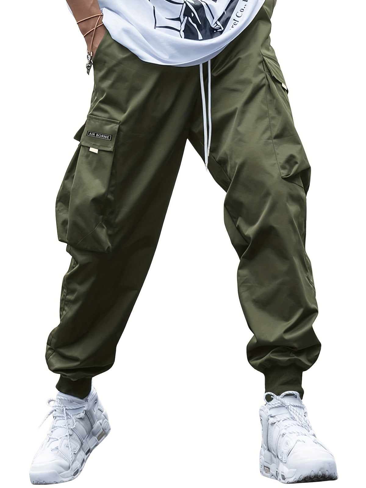 Multi-pocket cargo pants in olive green with a drawstring waist and Air Borne logo patch.