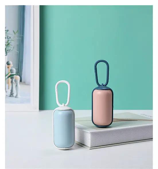 Portable poop bag holder dispenser set: two AdTec units in light blue with white loop and pink with navy loop.