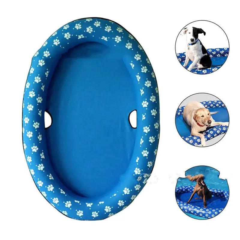 Dog pool inflatable hammock in blue with white paw-print border; floating pet bed with side handles.