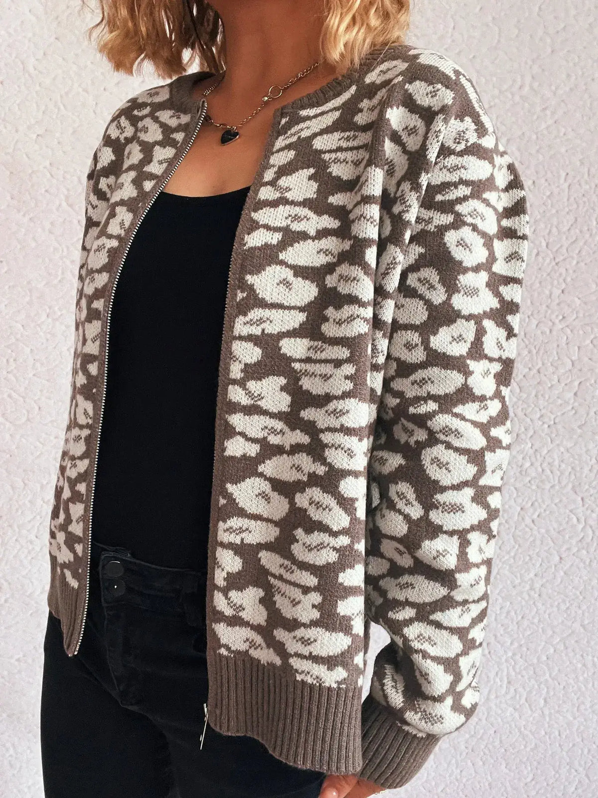 Zip Up Long Sleeve Cardigan in taupe leopard knit with front zipper and ribbed cuffs and hem.