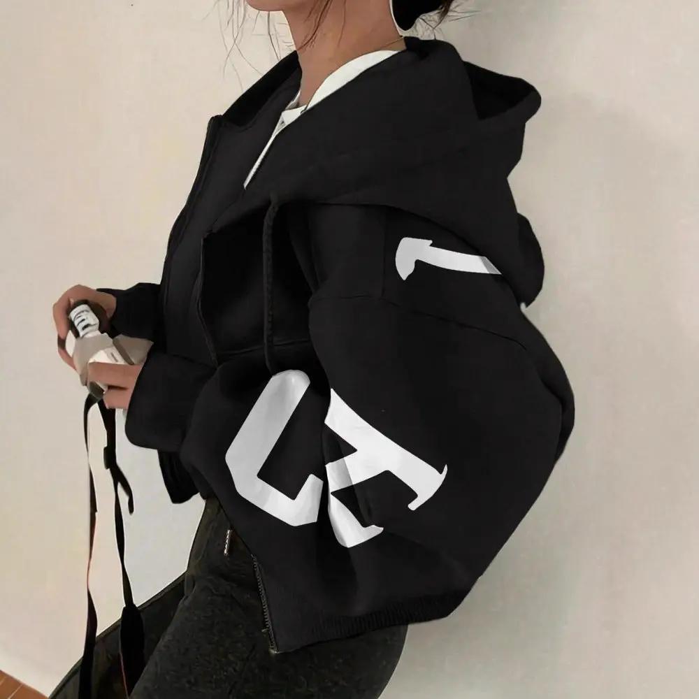 Soft full-zip hoodie in black with bold white graphic on the sleeve, oversized