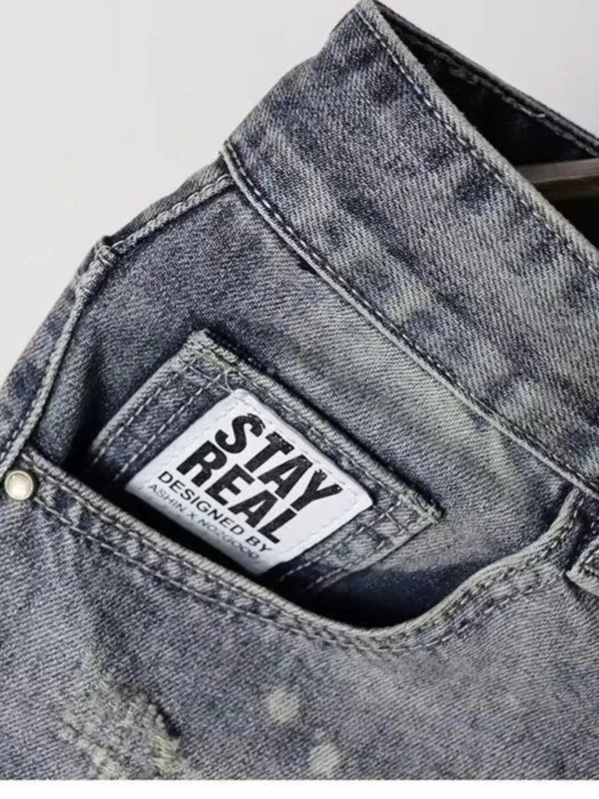 Mens lightweight stretch denim shorts in grey with front pockets and Stay Real label.