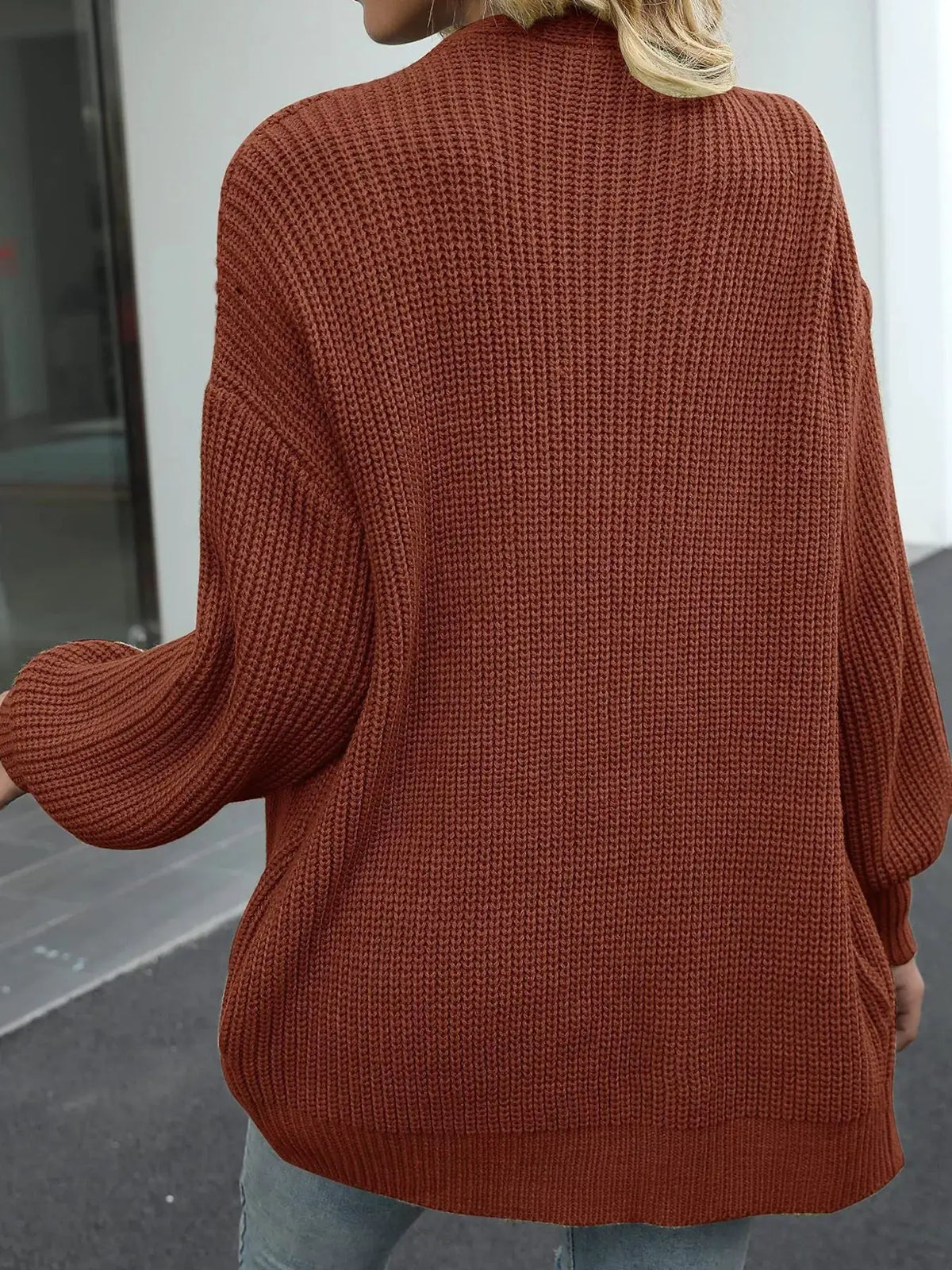 Oversized chunky-knit open-front cardigan in rust color with stretch fabric