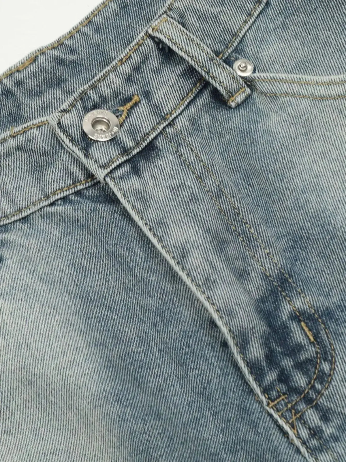 Men's washed blue denim shorts close-up of front pocket and metal button with yellow stitching