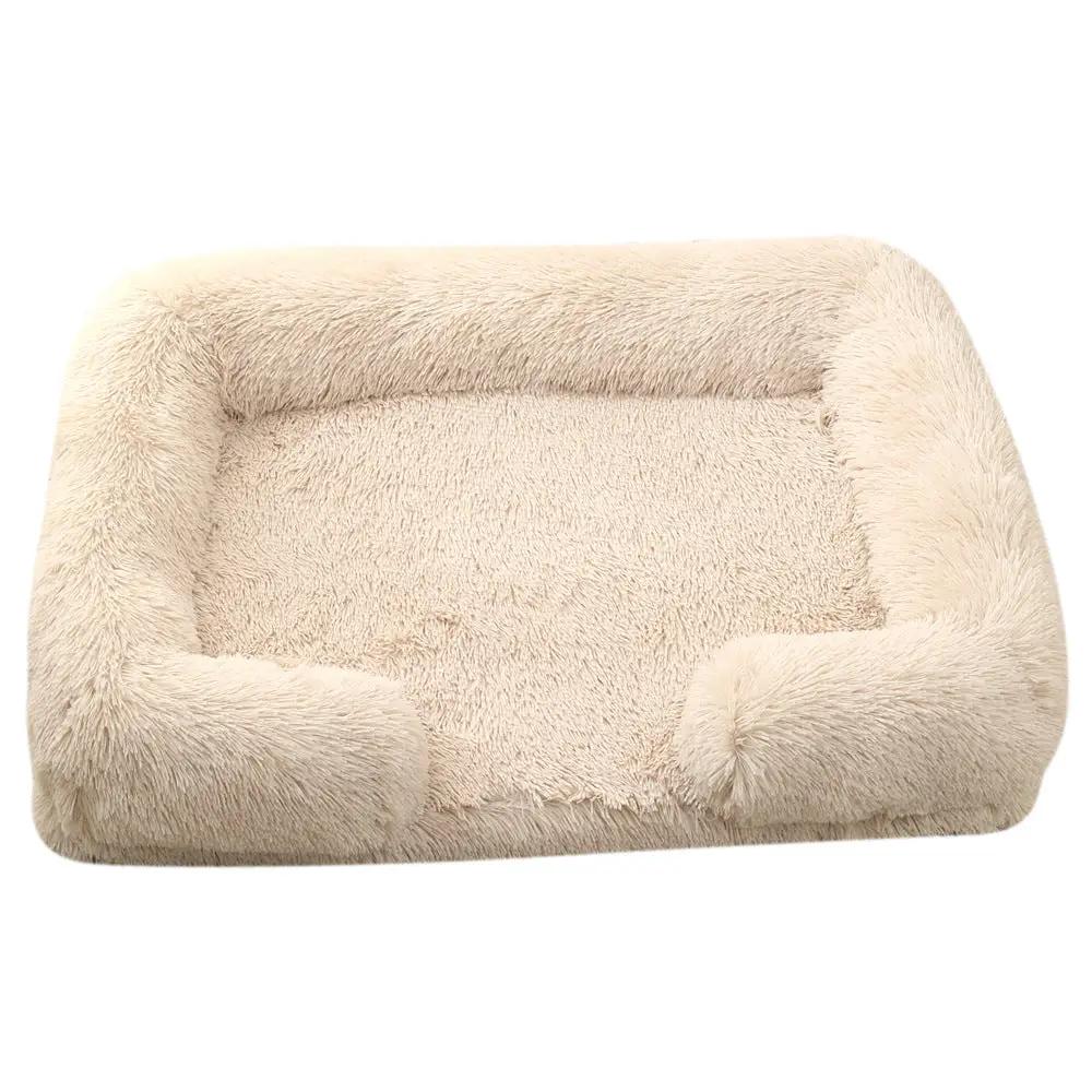 Plush round pet bed in beige with fluffy, cushioned raised sides.