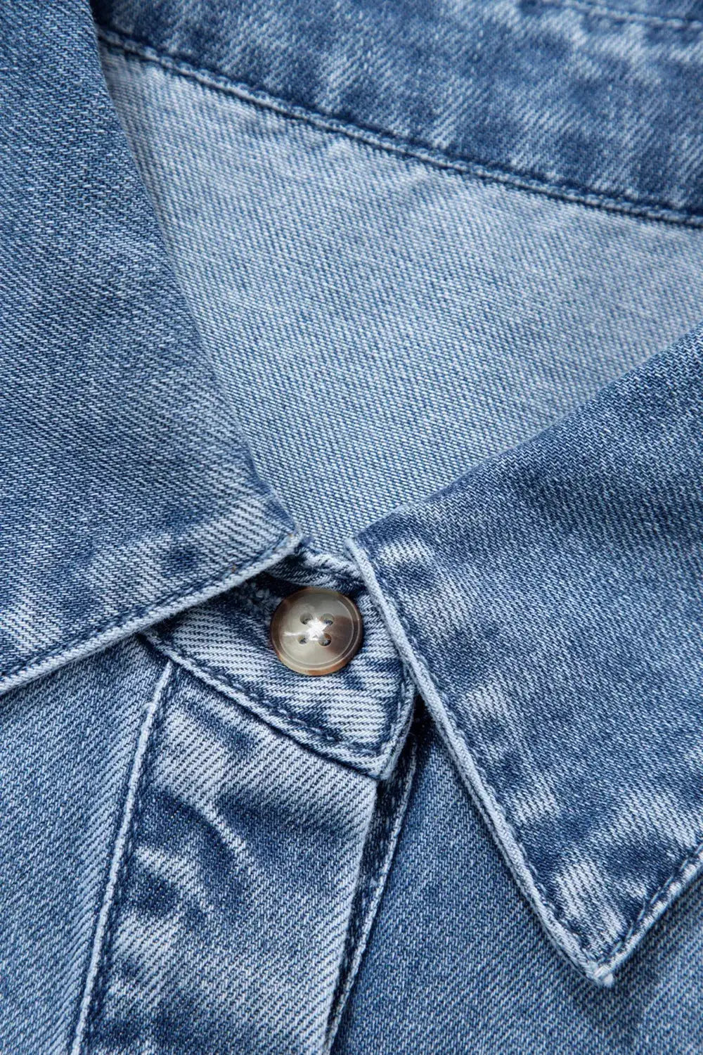Structured collar puff sleeve denim shirt in blue cotton blend with metal button placket detail