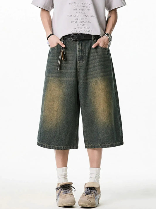Men's plus-size stretchy denim shorts with deep pockets, dark-wash knee-length, belt.