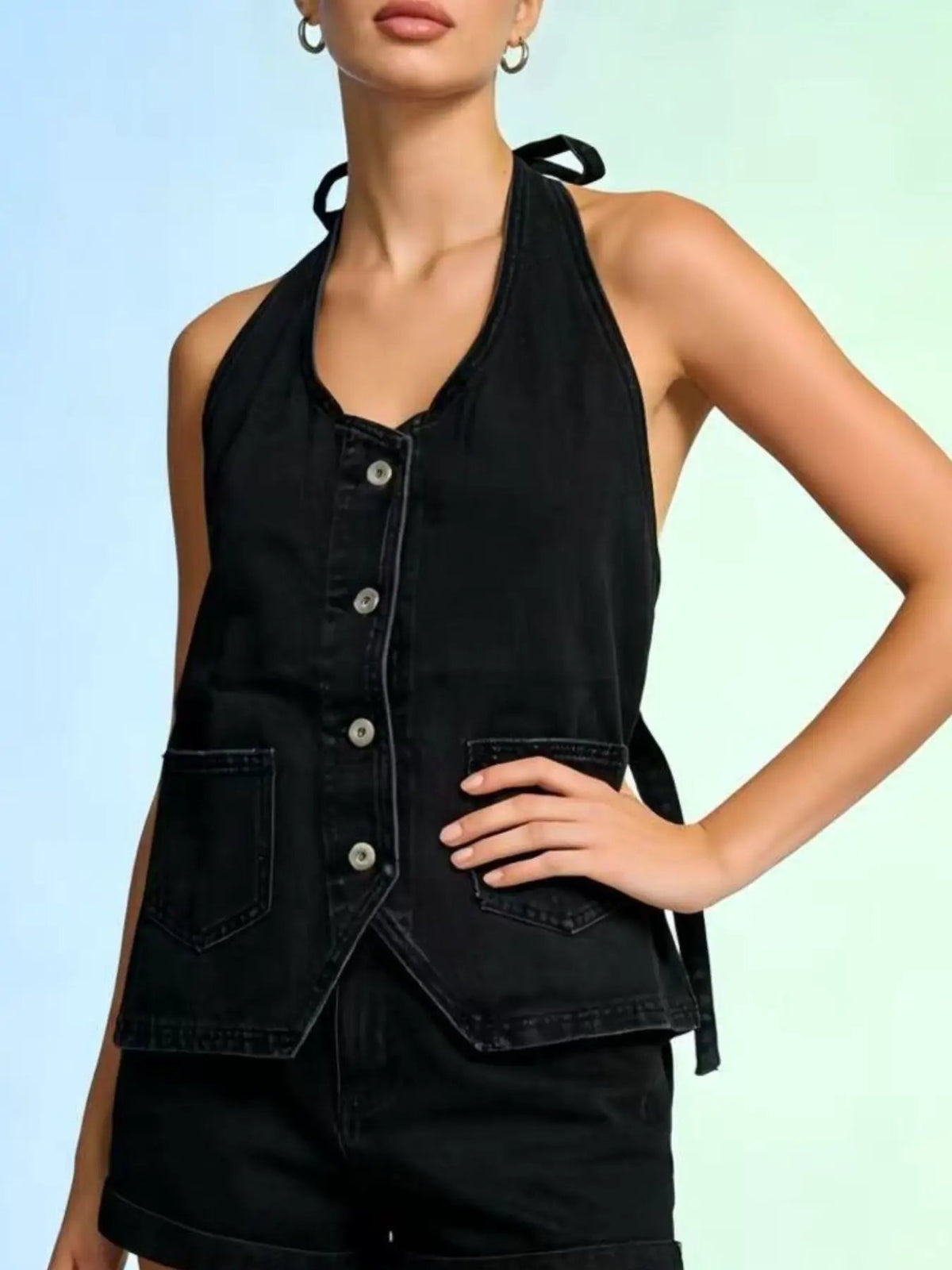 Halter-neck black denim vest with front buttons and adjustable tie closure