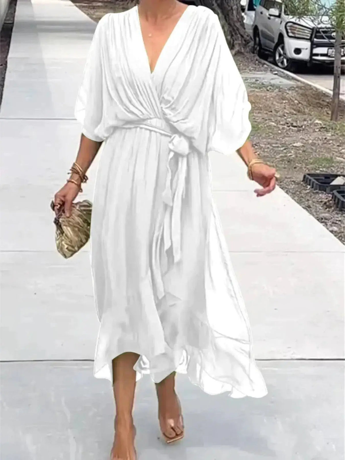 Plus-size white flowy tie-front midi dress by Trendsi with flutter sleeves