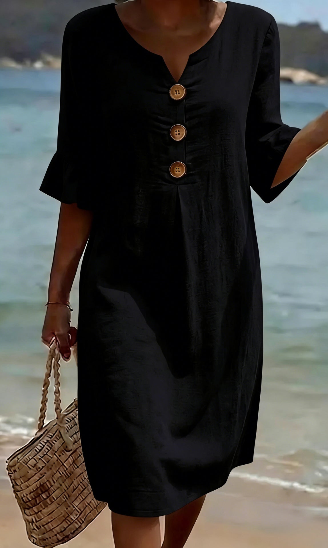 Summer women's solid-colored black cotton dress with three brown front buttons, 3/4 sleeves