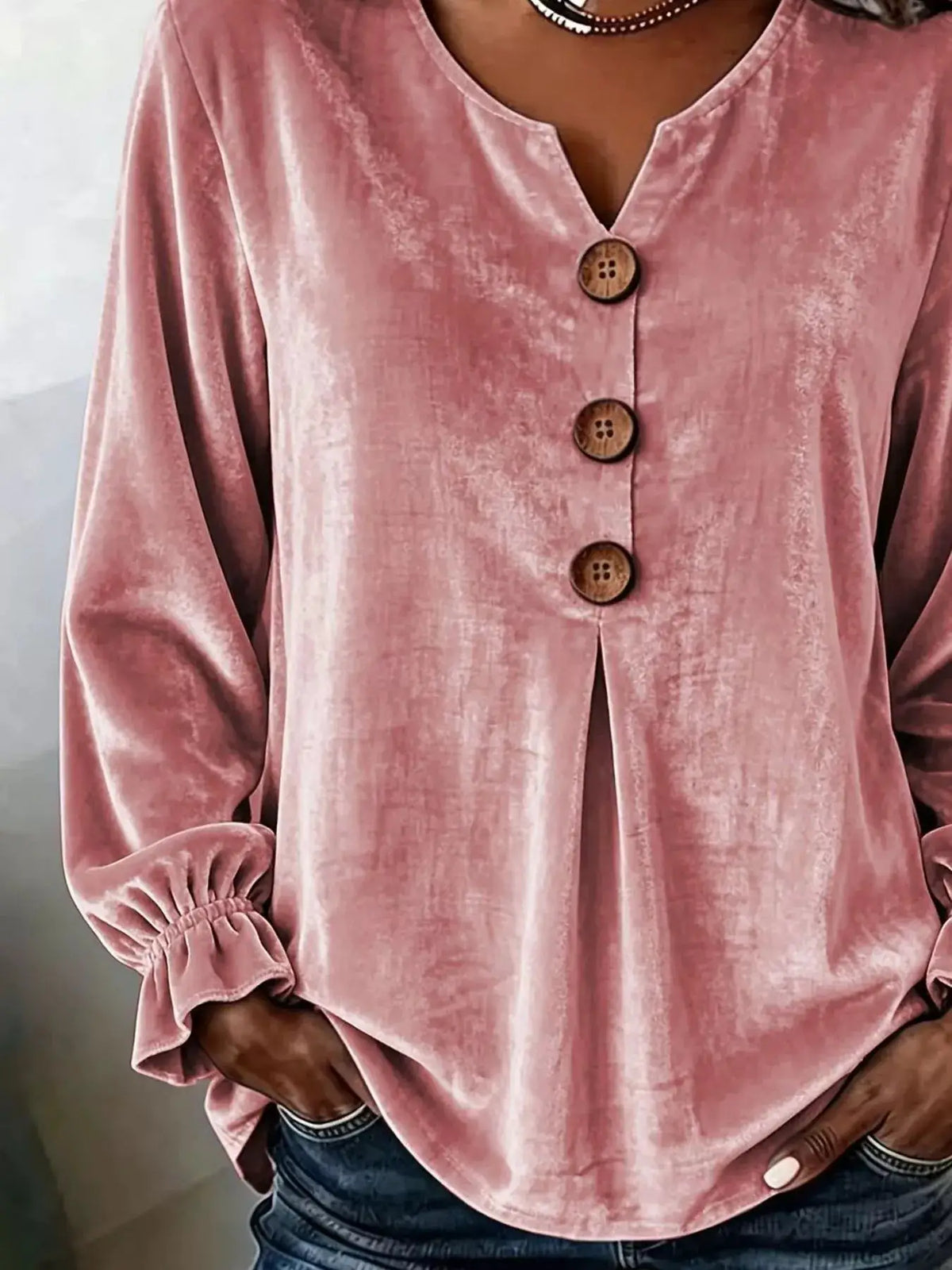 Plus-size pink velvet button-front blouse with ruffled cuffs