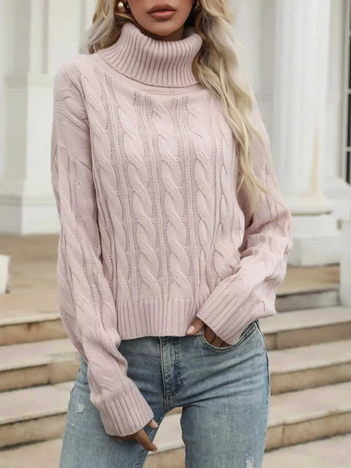 Cozy cable-knit turtleneck sweater in pale pink by Trendsi; soft, stretchy pullover.