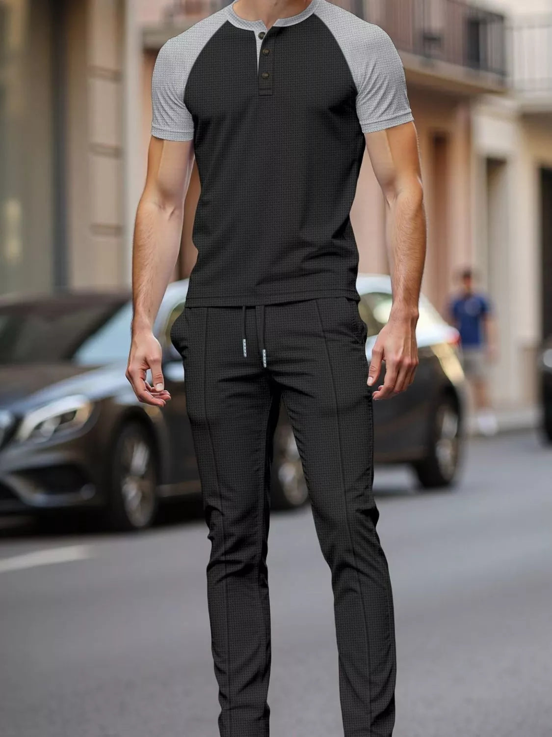 Men's two-tone raglan tee and matching drawstring pants set, black body with gray sleeves.