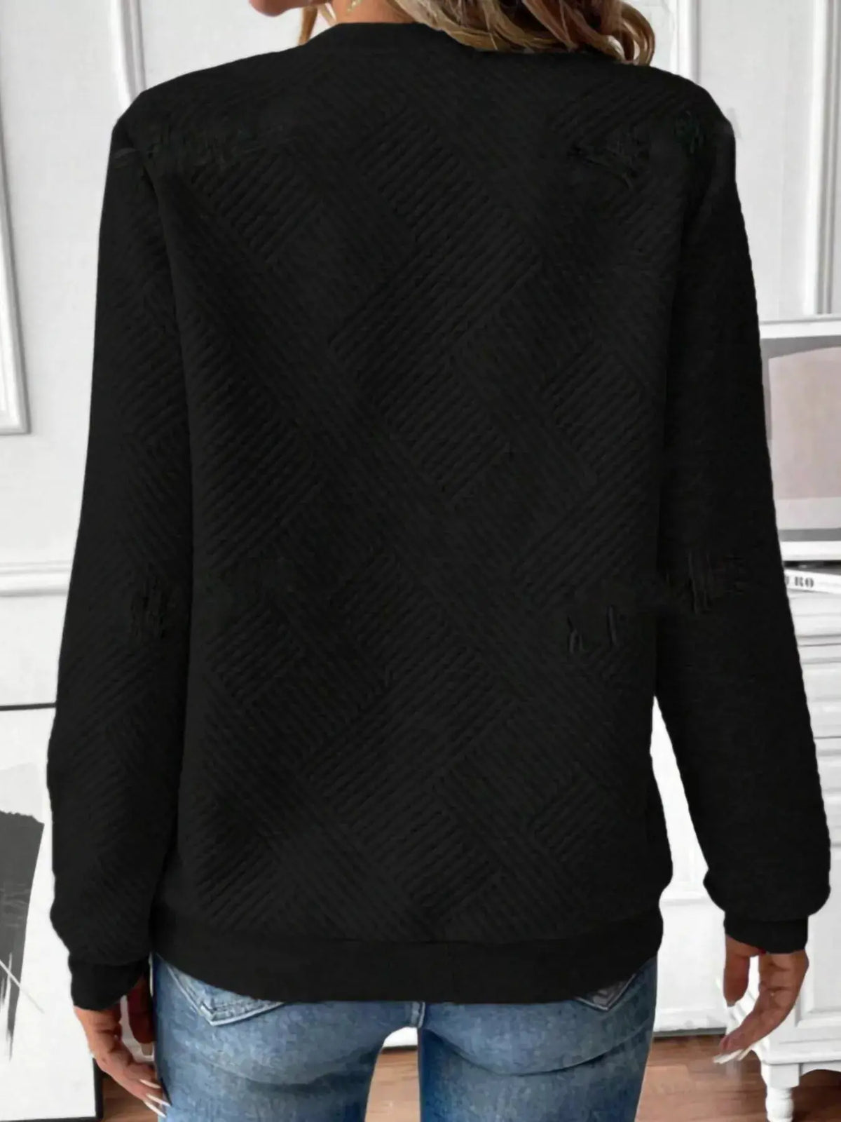Textured black Quarter-Zip Sweatshirt, back view with diagonal quilted pattern.