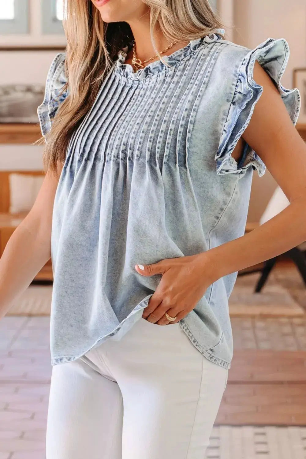 Vintage washed light-denim top with pleated front and ruffled sleeves