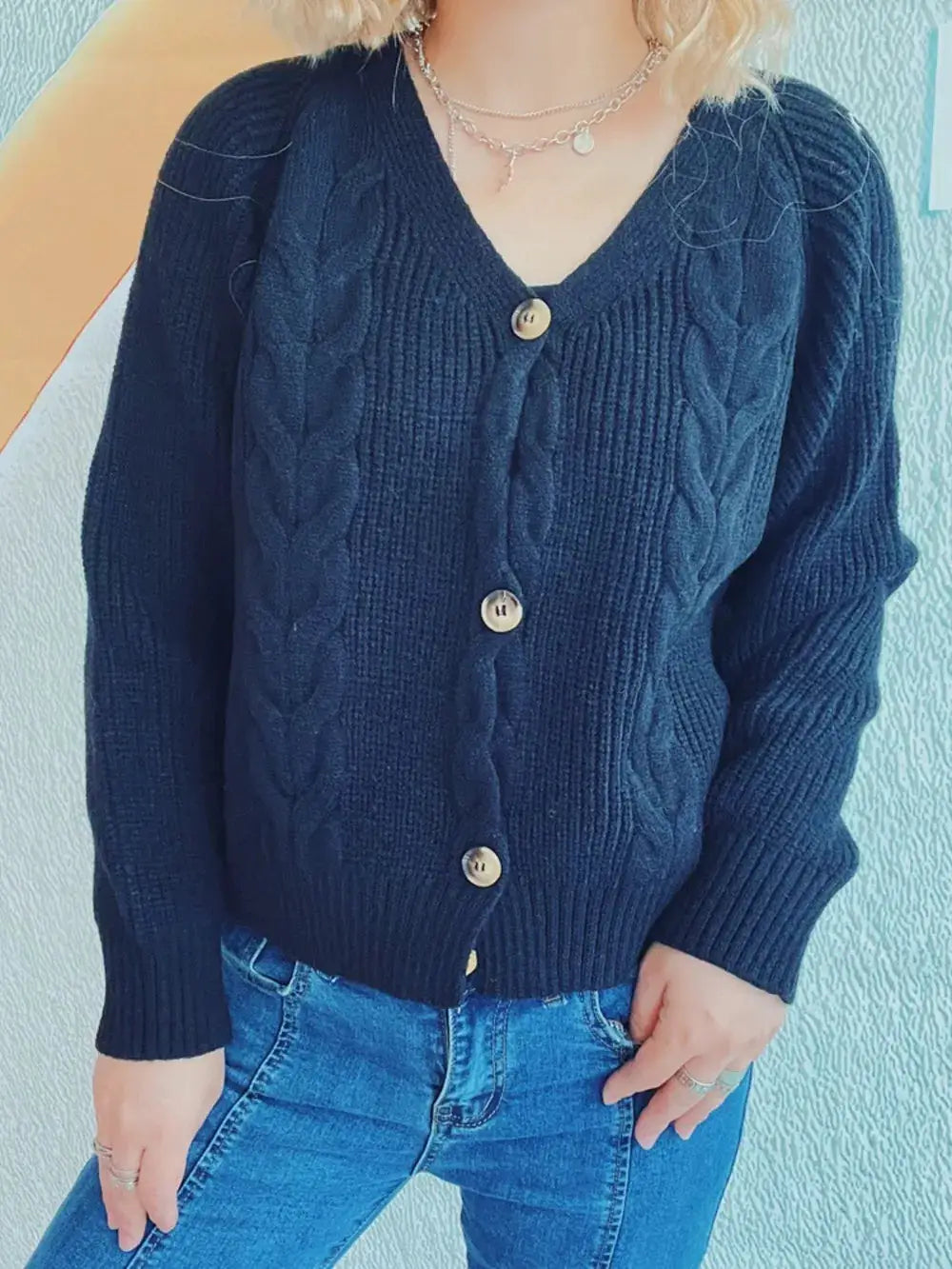 Cardigan: navy cable-knit with V-neck and button-front long sleeves